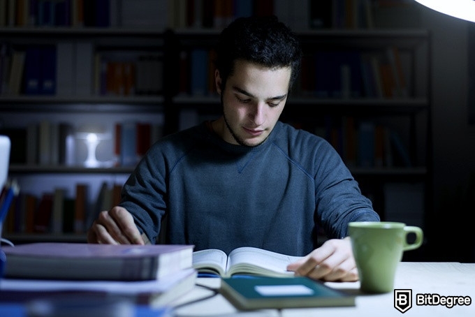 Harvard CS Course: a man studying at night.